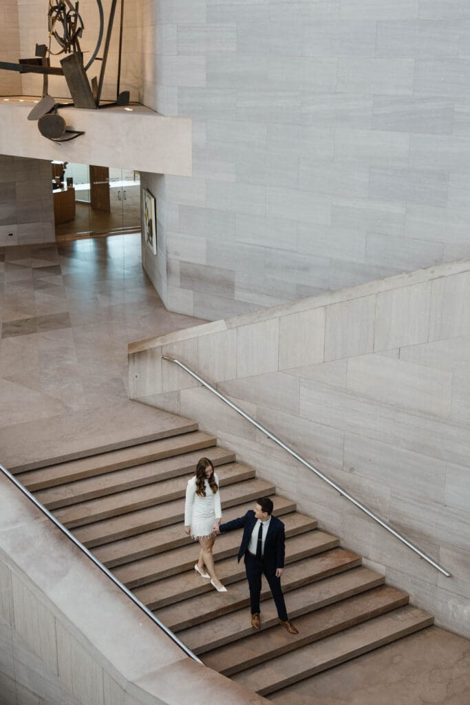 Couple enjoying the iconic National Gallery of Art staircase