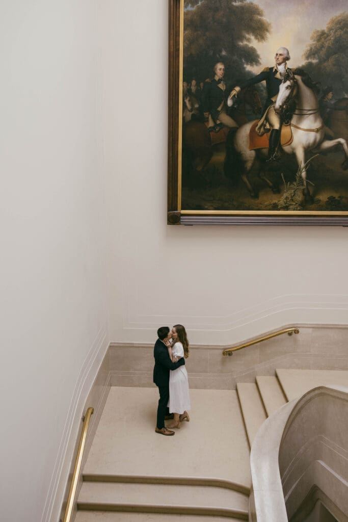 Intimate moment shared on the grand staircase