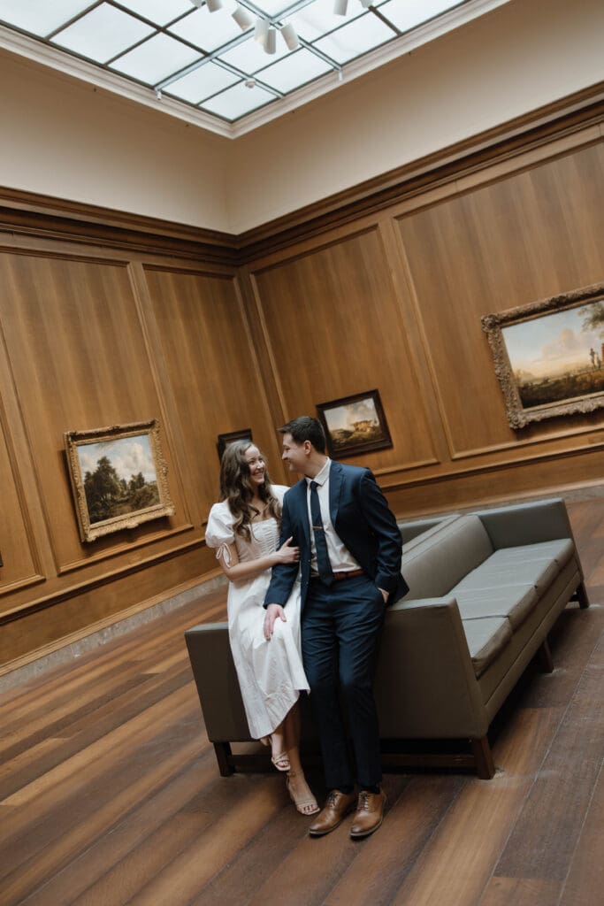 Art Museum Engagement Session while sitting on the couch