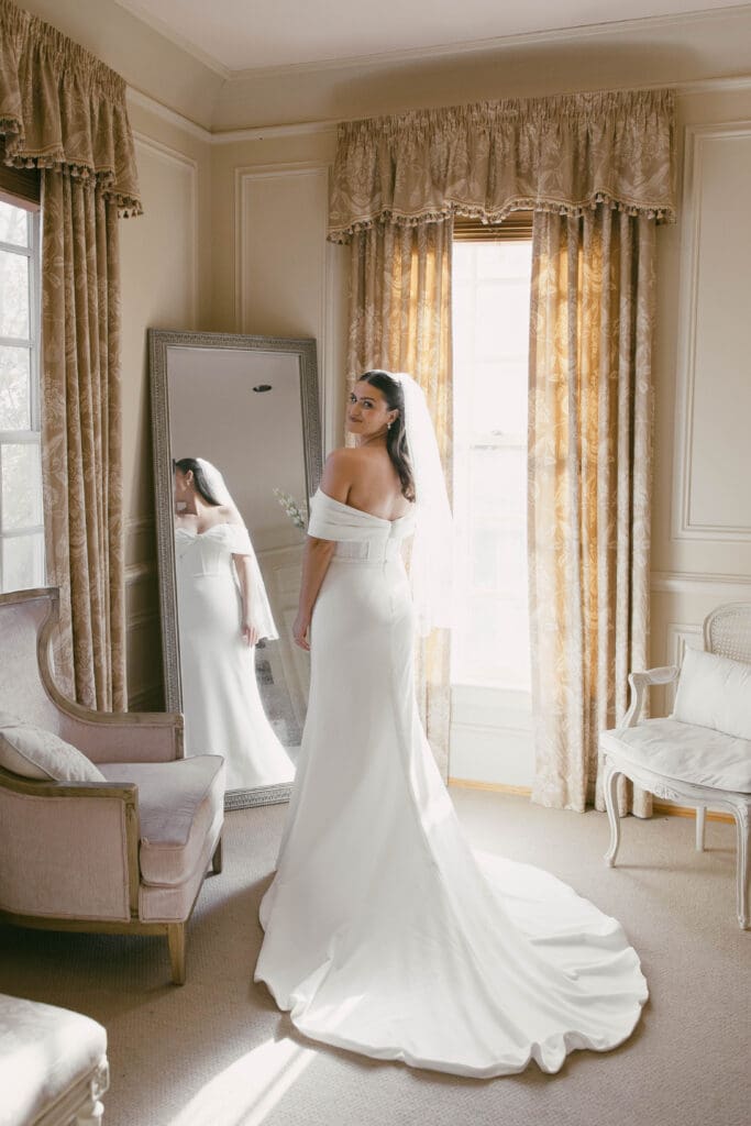 The bride in the bridal suite looking back.